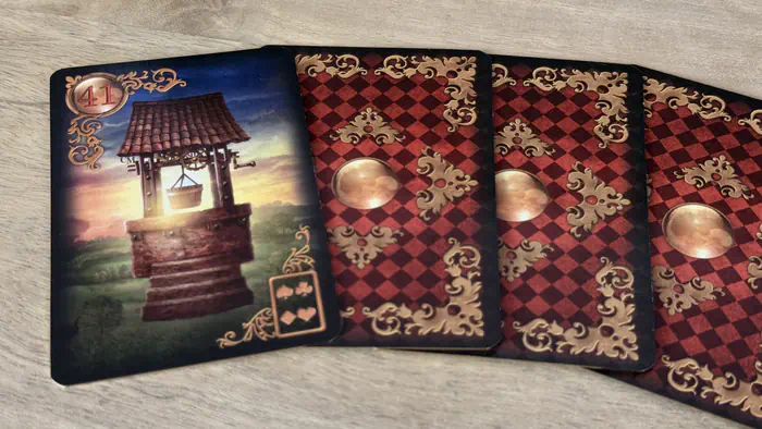 Carte Le Puits 41 Gilded Lenormand représentant les ressources intérieures et la profondeur spirituelle.