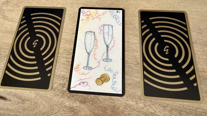 Deux flûtes à champagne avec serpentins, illustration de la carte 20 de l'Oracle Gé : Les Deux Flûtes.