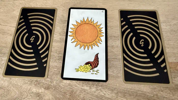 Un soleil et une corne d'abondance, illustration de la carte 1 de l'Oracle Gé : Le Soleil.